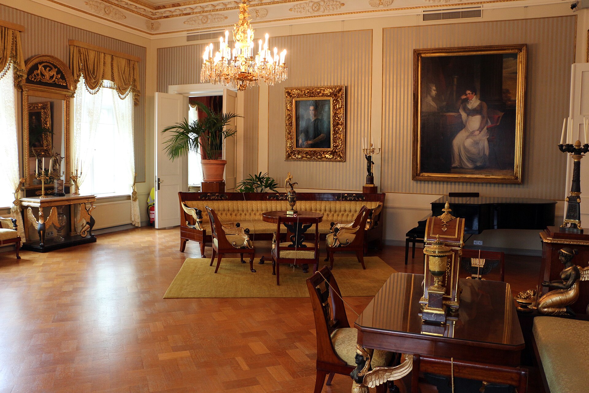 The Empire Hall in the Sinebrychoff house museum, with gilded period furniture against patterned walls