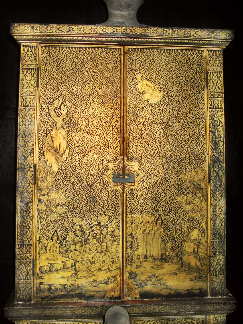 A gilt lacquer manuscript cabinet on display in one of the teak houses