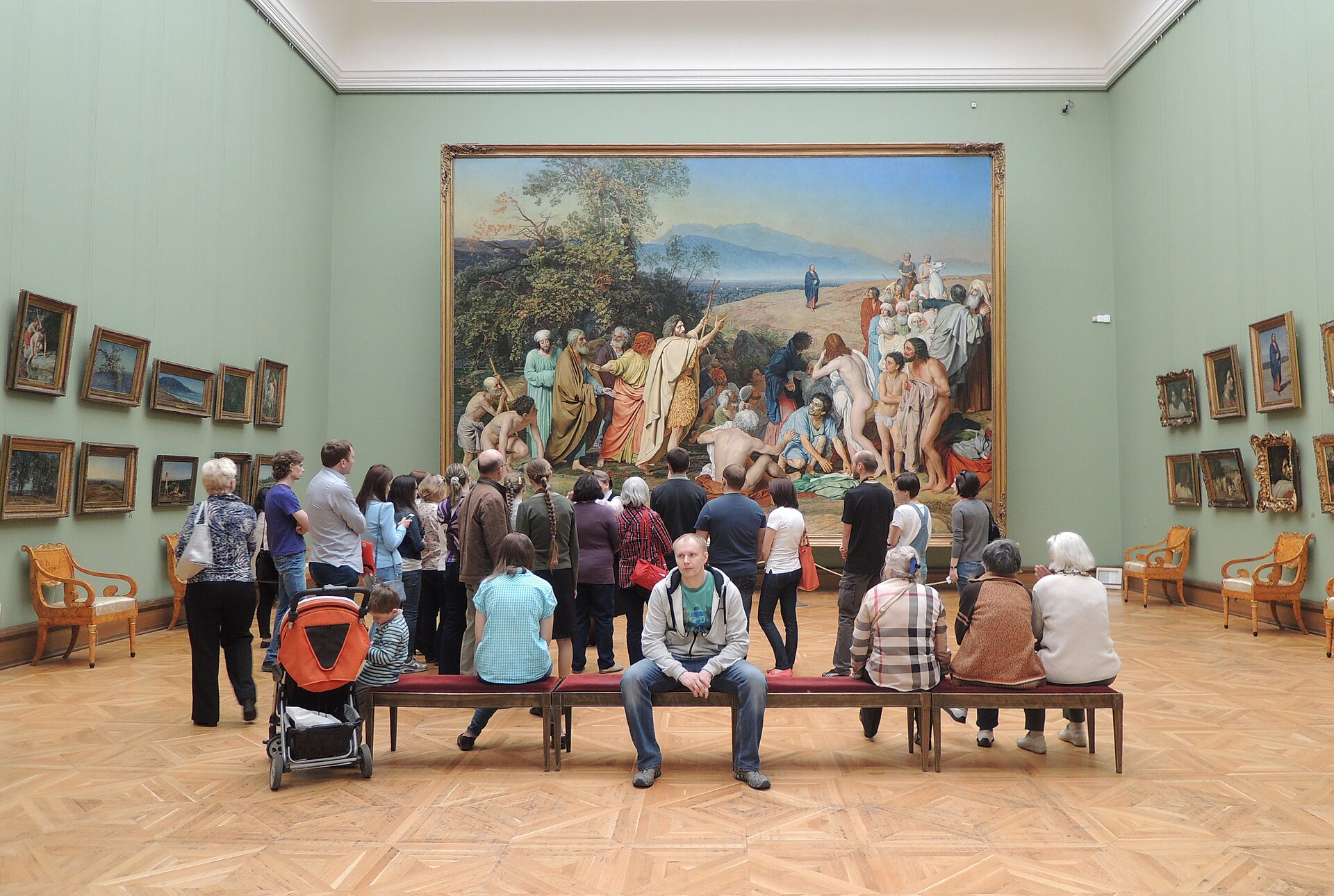 The purpose-built room holding Alexander Ivanov's The Appearance of Christ to the People, with visitors seated on benches before the canvas