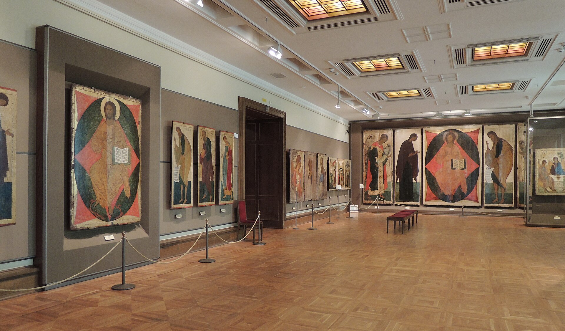 Icon hall in the Tretyakov Gallery showing tiered Deesis-rank icons associated with the Andrei Rublev circle