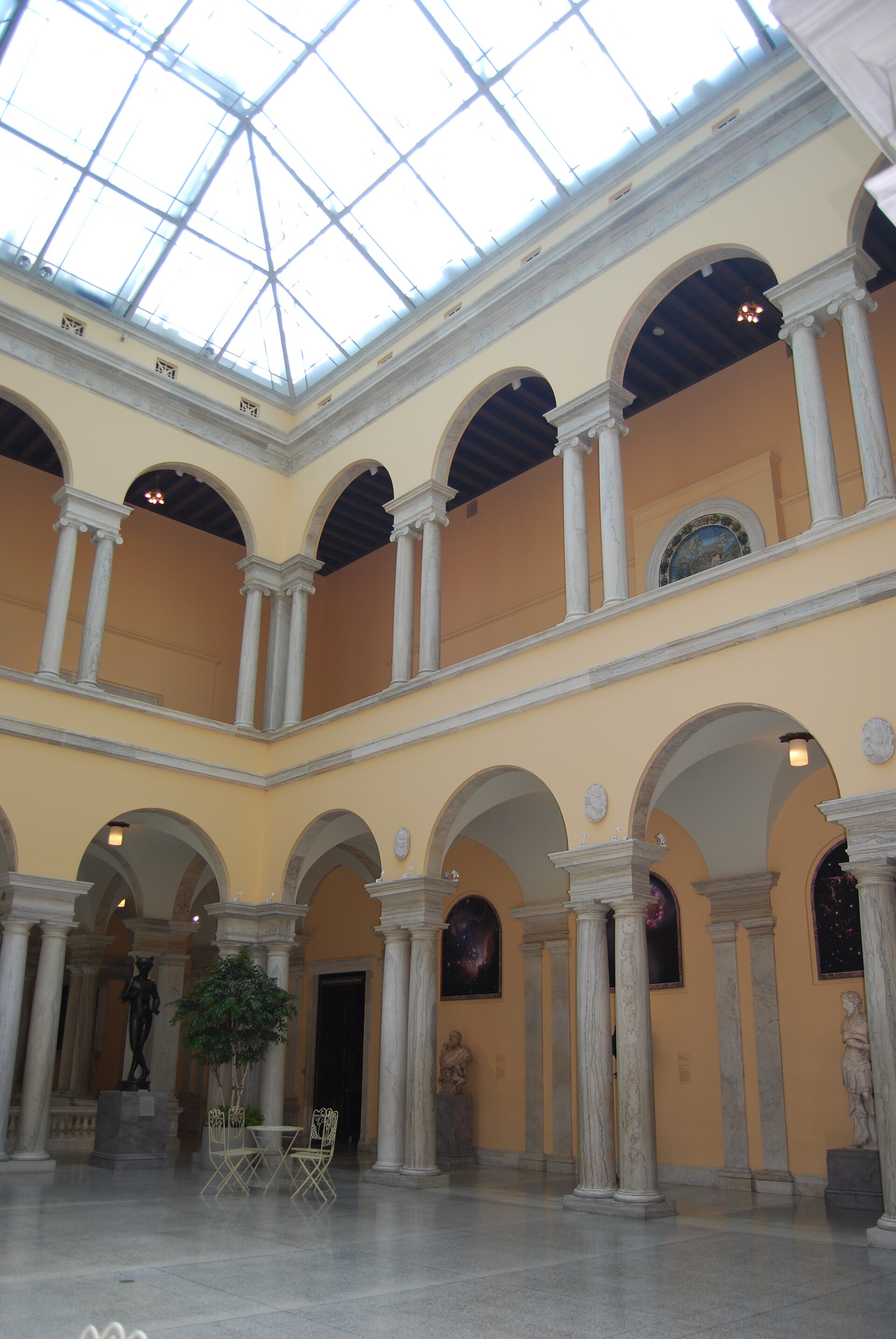 The sky-lit, colonnaded Sculpture Court inside the Walters' 1909 palazzo building, with classical statuary set between marble columns
